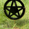 Obsidian pentacle – a polished five-pointed star in a circle, carved in black obsidian, symbolizing protection, clarity and spiritual grounding.