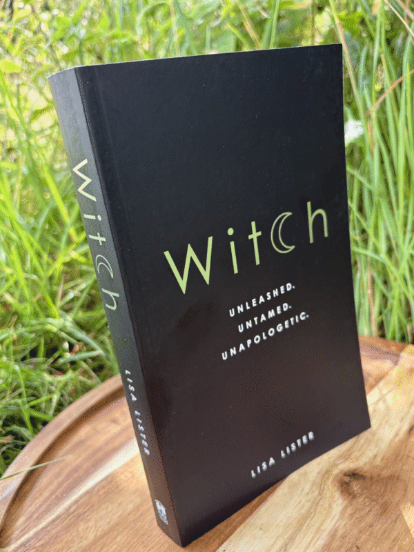 The book "Witch" standing upright against a grassy background, with silver-green title text and the subtitle "Unleashed. Untamed. Unapologetic.