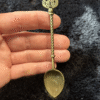 Soft gold ritual spoon with pear-shaped symbol – mystical spoon for herbs, teas, and altar rituals