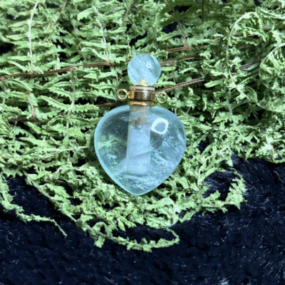 Heart-shaped crystal bottle pendant filled with prosperity intention oil – carry for abundance and wealth