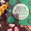 Witch’s 2026 Calendar surrounded by crystals and flowers