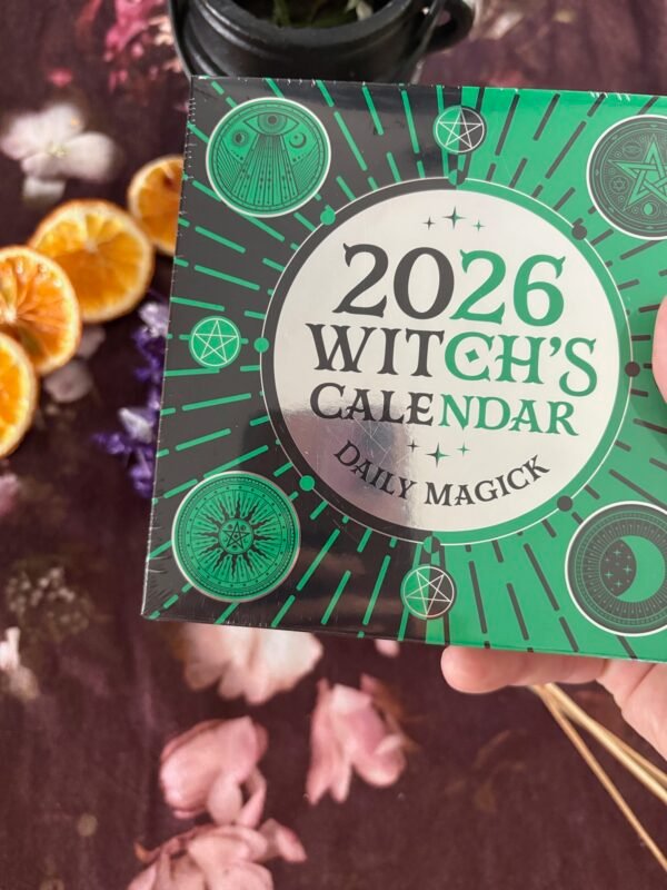 Witch’s 2026 Calendar surrounded by crystals and flowers