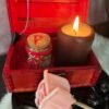 A small red wooden spell chest with vintage brass clasp, perfect for storing magical tools or using as a travel altar. Pictured open and closed, styled with runes, candle and witchy decor.