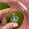 Heart-shaped Fluorit crystal bottle pendant filled with prosperity intention oil – carry for abundance and wealth