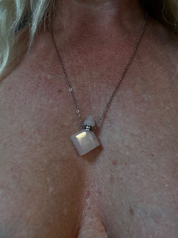 Rose quartz crystal bottle pendant with love oil and silver chain – wearable love talisman
