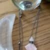 Rose quartz crystal bottle pendant with love oil and silver chain – wearable love talisman