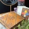Two hand-carved vintage wooden boxes with mystical designs, perfect for tarot cards, crystals, or as a travel altar.