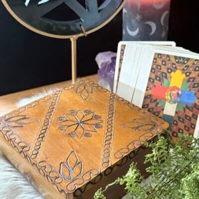 Two hand-carved vintage wooden boxes with mystical designs, perfect for tarot cards, crystals, or as a travel altar.