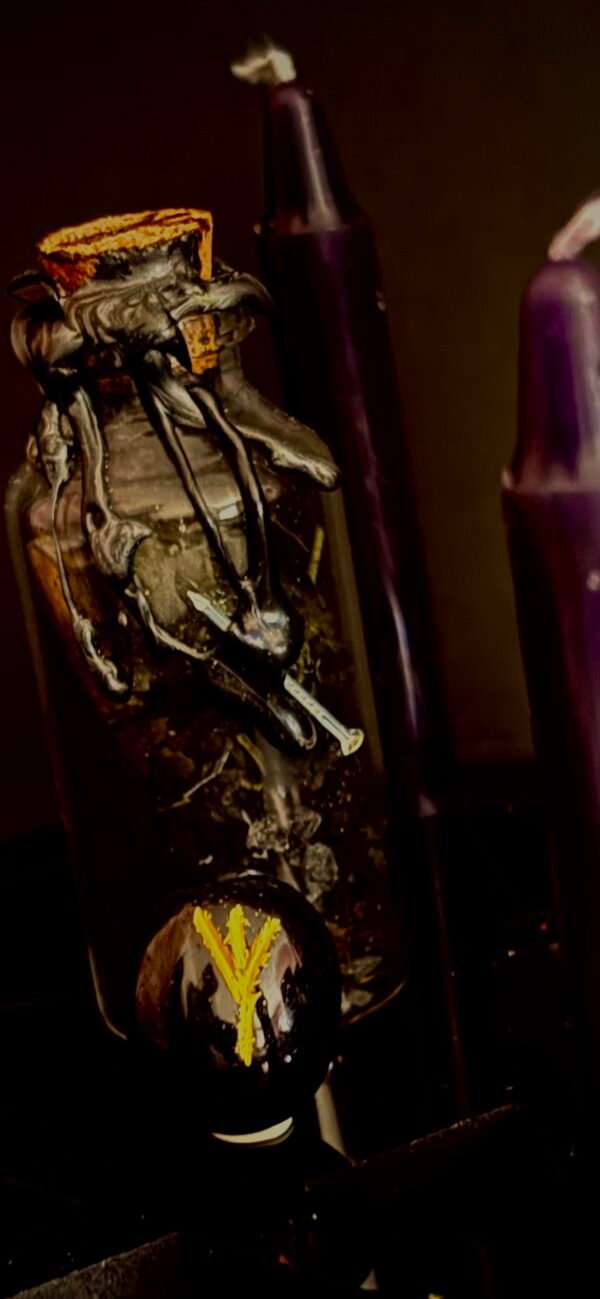 Close-up of protection spell jar sealed in black wax with nail and Algiz rune – dark witchcraft ritual object