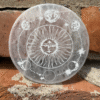 Selenite charging disc with lunar mandala engraving, 10x10 cm, with natural internal cracks and variations