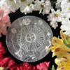Selenite charging disc with lunar mandala engraving, 10x10 cm, with natural internal cracks and variations