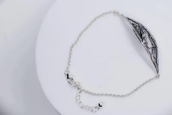 Back view of "Nattuggla" silver bracelet showing chain and clasp detail.