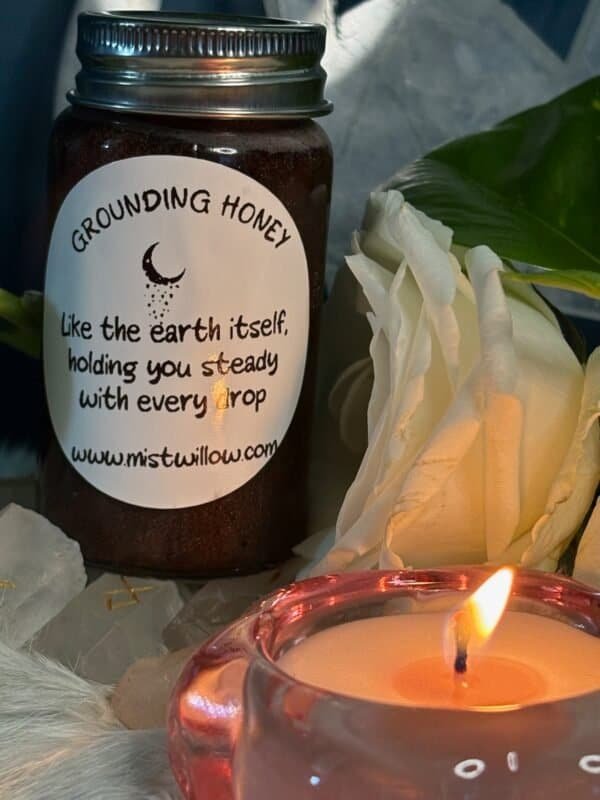 Grounding Honey jar with white rose and candle – Mistwillow ritual honey for stability and earth connection.