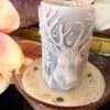 DUNEYRR Nordic prosperity candle with deer motif, handcrafted in rapeseed wax with malachite crystals in a soft pink bowl