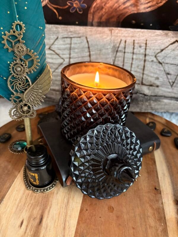 Grimoire ritual candle with flame in dark setting